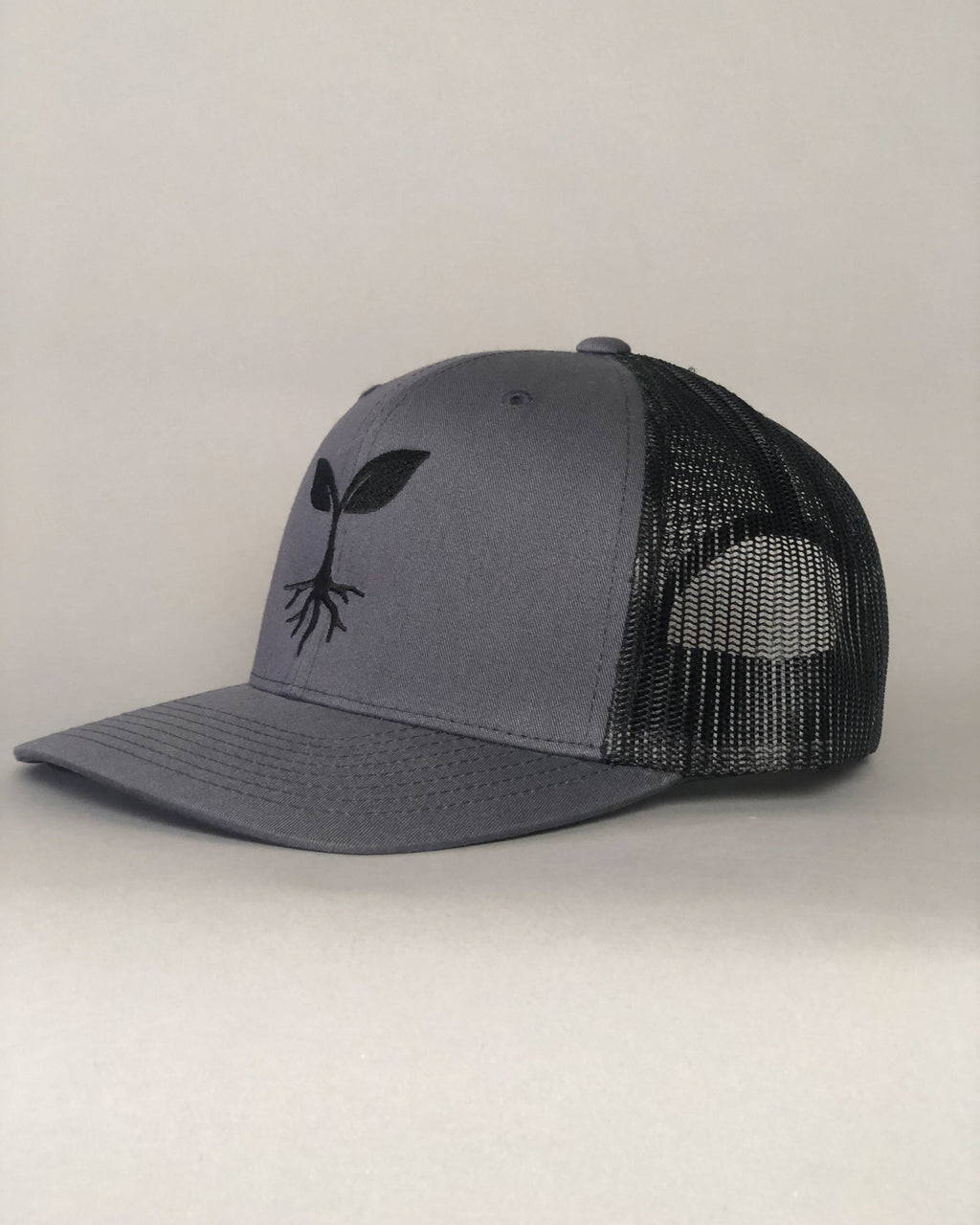 Embroidered Seedling Graphite Truckers Hat